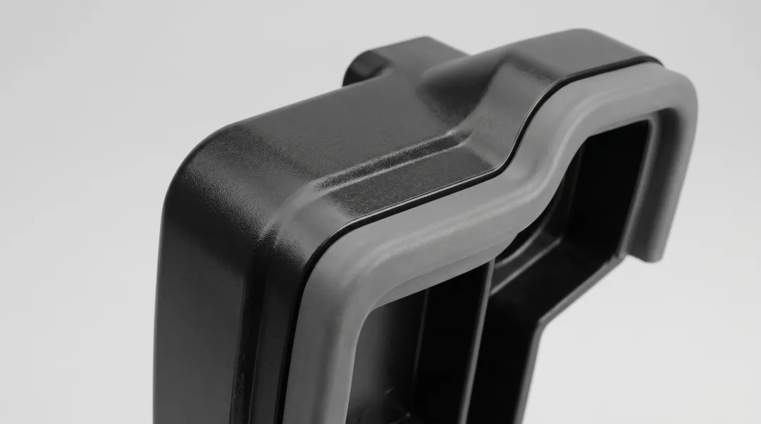 Multi-material injection molded automotive interior components showing dual-shot construction