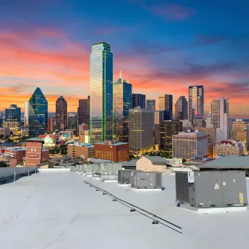 Commercial building with multiple HVAC units on rooftop in Texas
