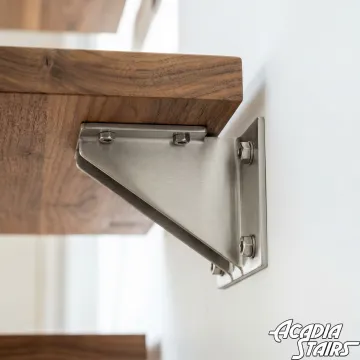 Close-up of floating staircase construction showing hidden wall mounting system