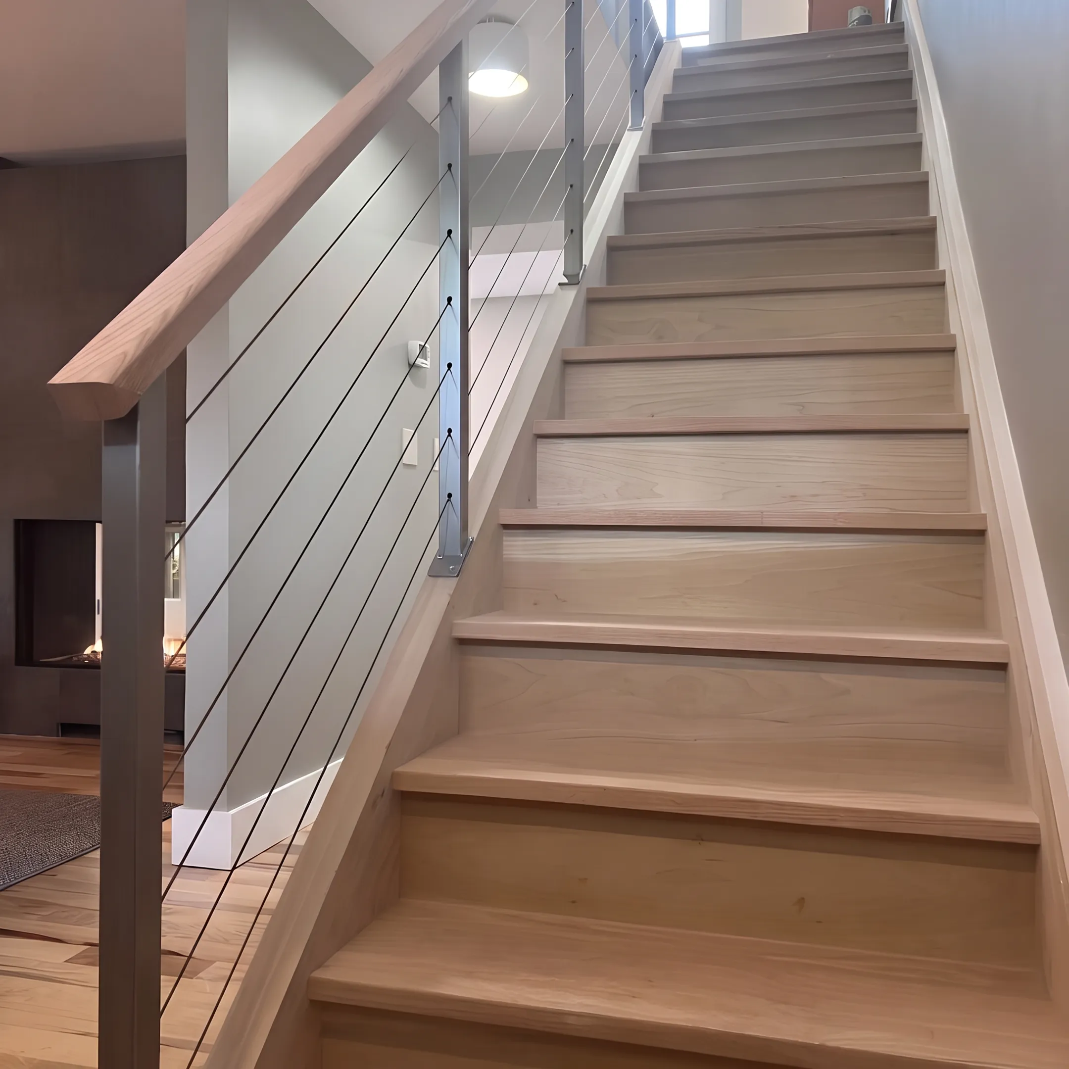 Custom welded steel architectural handrail installed on a modern staircase