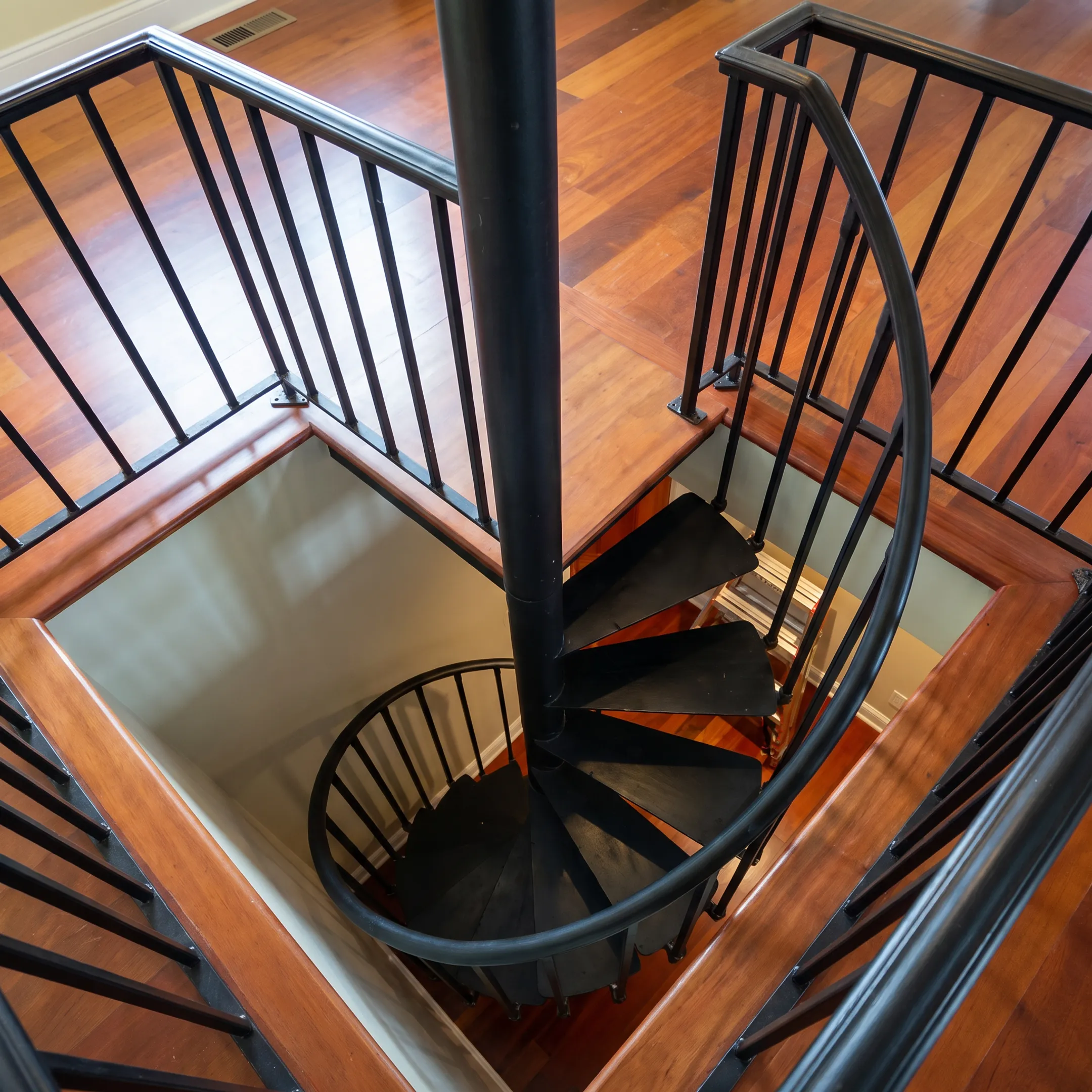 Custom wrought iron stair railing on a contemporary staircase