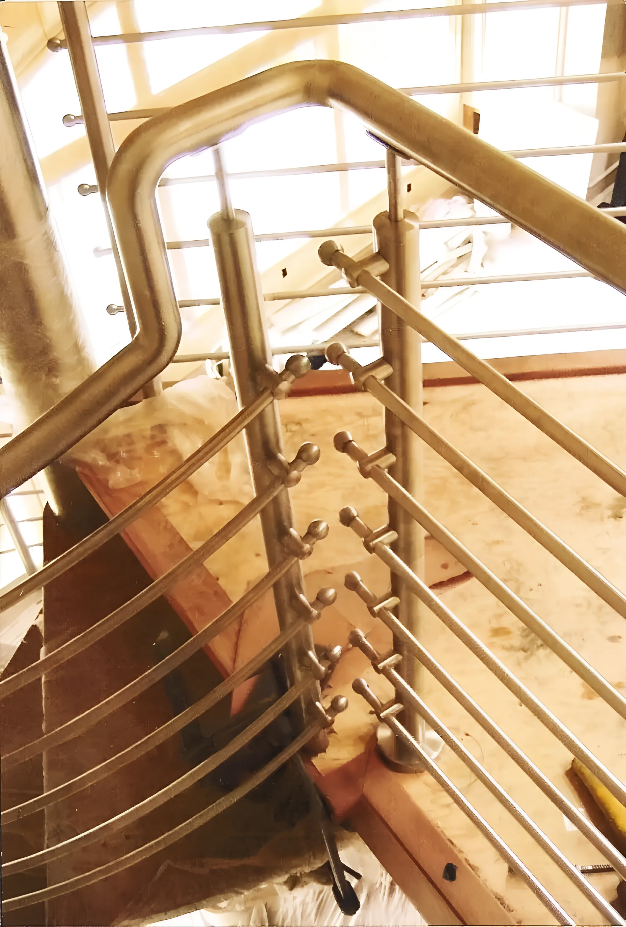 Contractor installing cable railing
