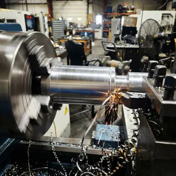 Precision lathe machining operation producing a turned metal component