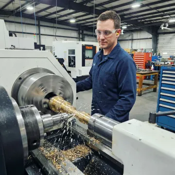 CNC enhanced screw machining operation producing high-precision metal components