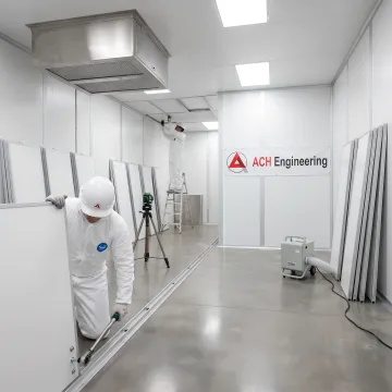 Modern modular cleanroom facility under construction showing professional installation team