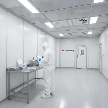 Technicians working in contamination-controlled cleanroom environment for data recovery