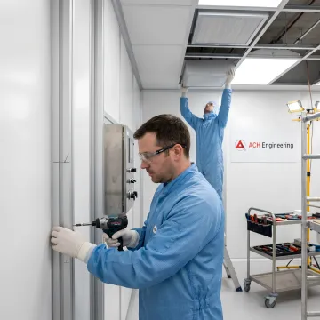 Pharmaceutical cleanroom equipment installation showing modular walls and HEPA filtration systems