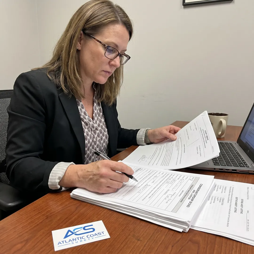 Surety specialist reviewing conservatorship bond documents