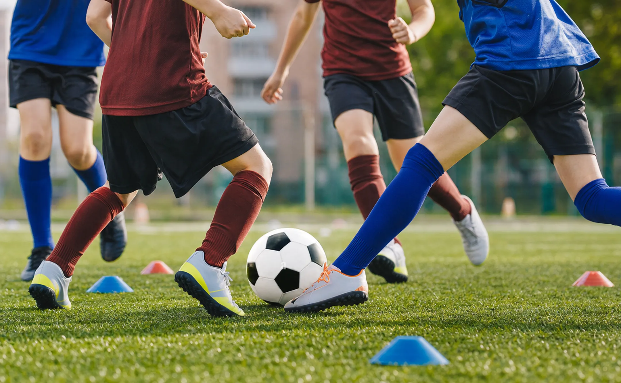 Youth soccer players performing small-sided game drill on training field