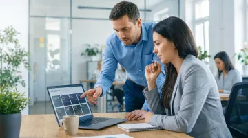 Fractional sales professional reviewing CRM pipeline dashboard with startup founder