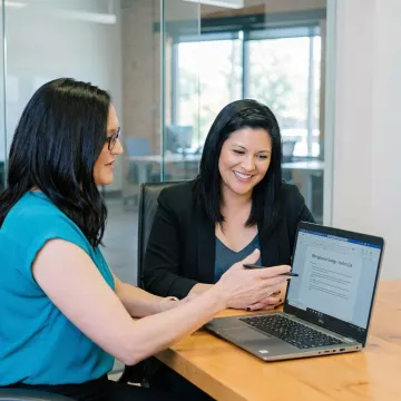 MBA career coach guiding a professional candidate through application strategy