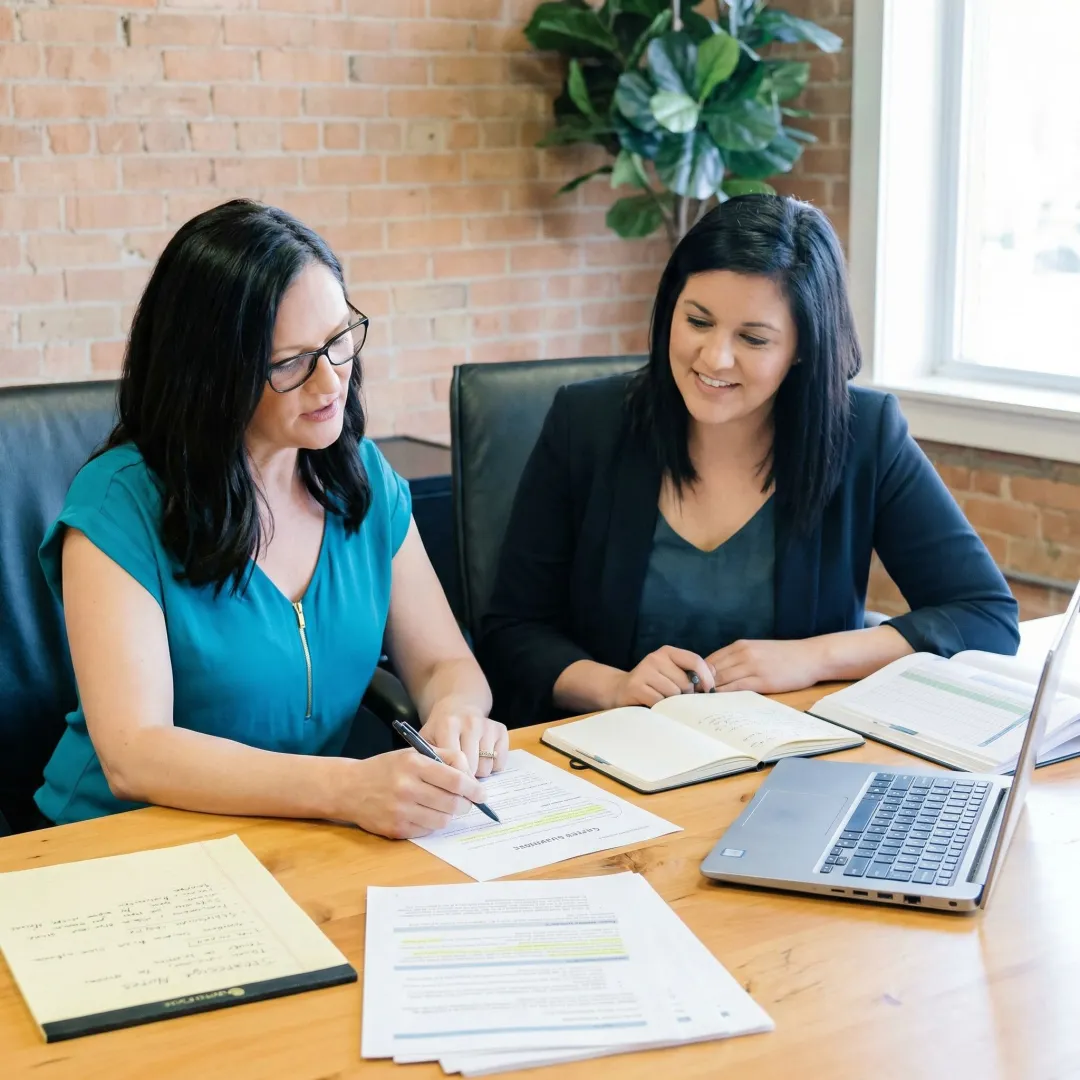 MBA career pivot narrative consulting session with applicant and consultant reviewing application story