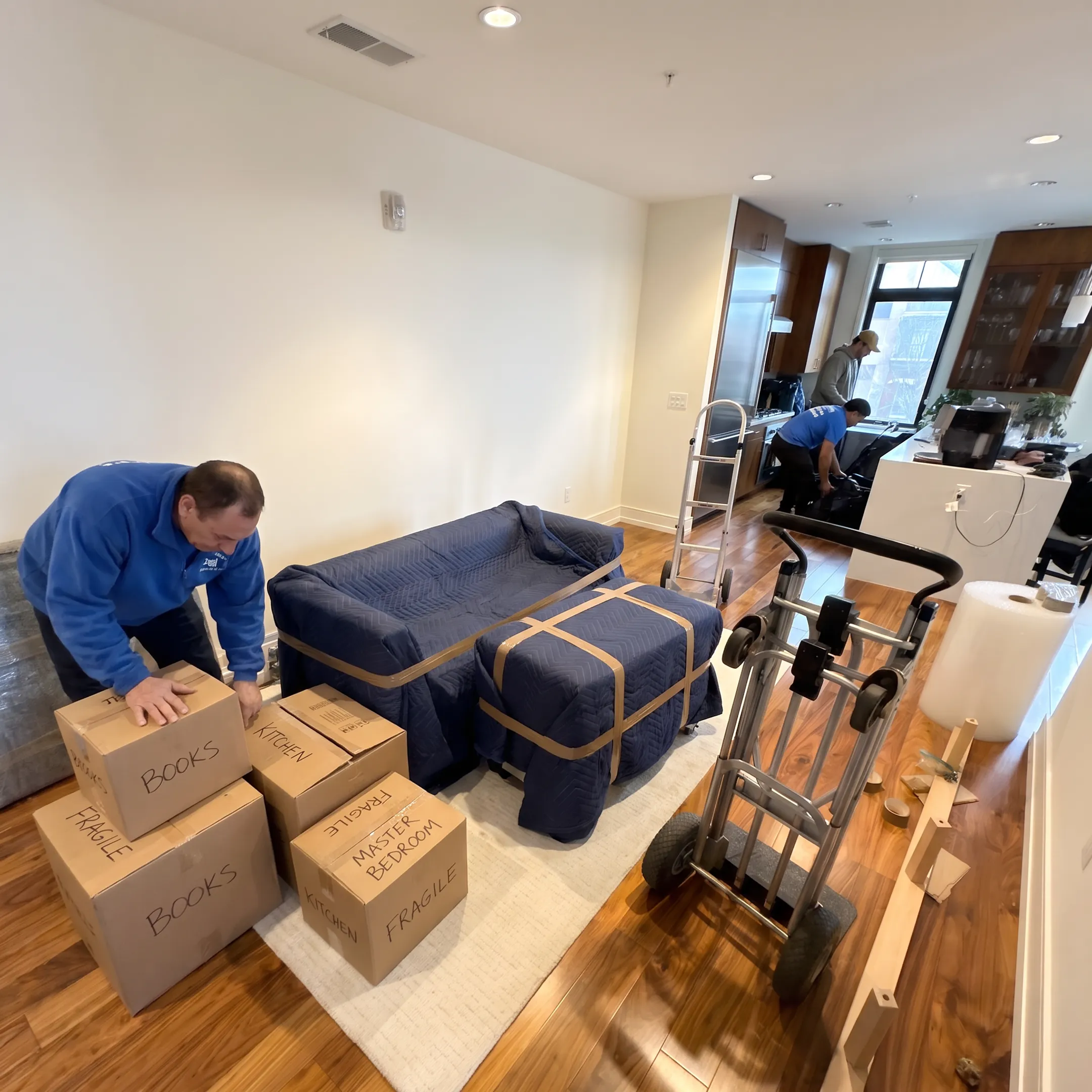 Mover organizing packed belongings for a coordinated Potomac relocation