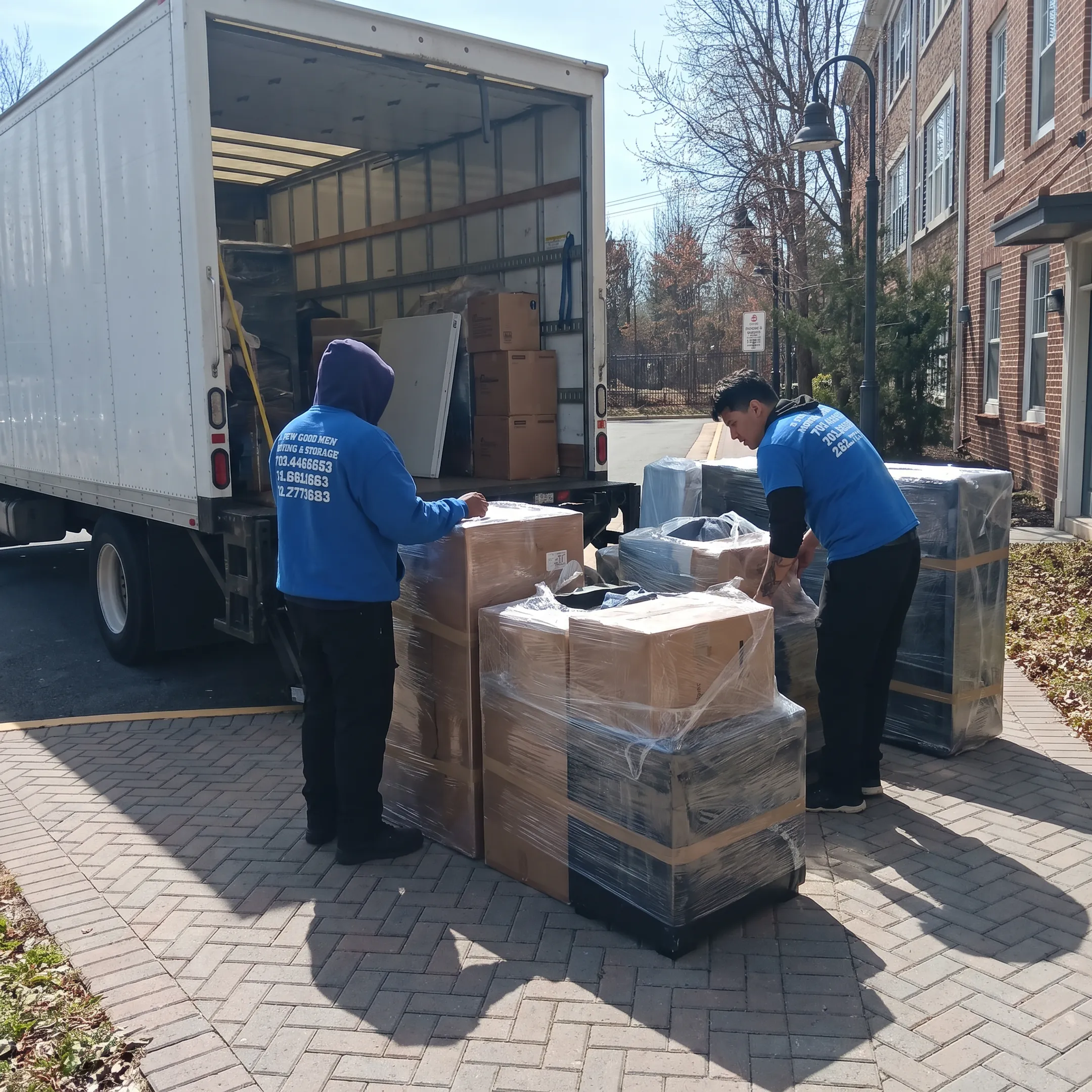 Moving professionals organizing boxes for interstate delivery