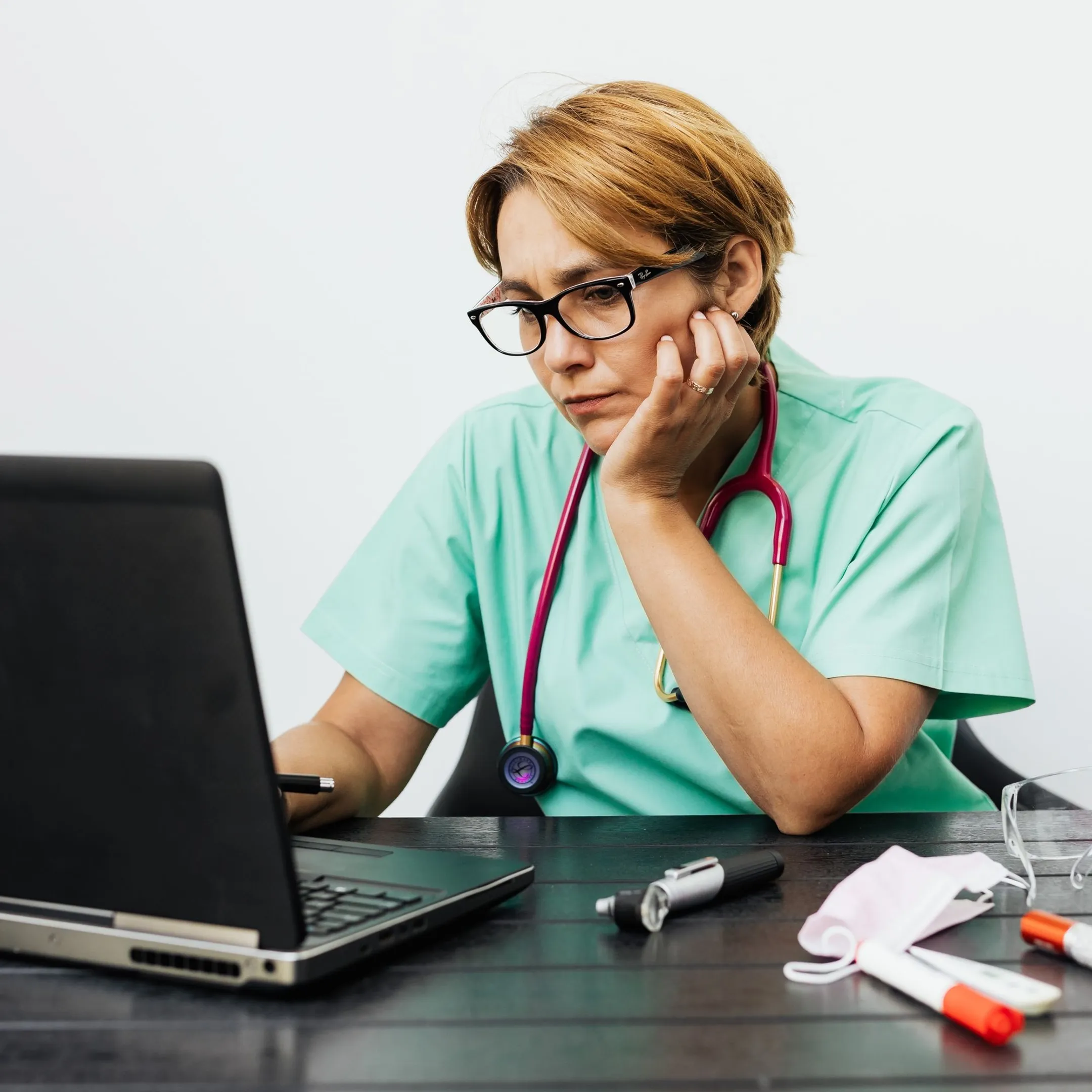 Healthcare professional reviewing medical records with a private AI interface