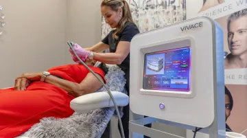 Dermatologist performing RF microneedling treatment on patient in clinical setting