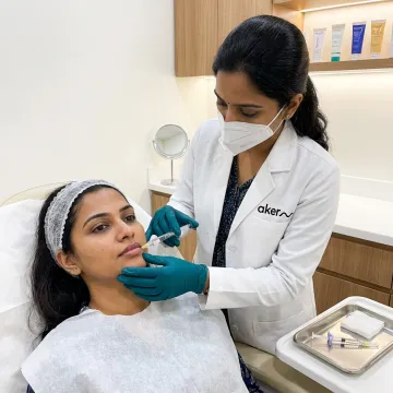 Dermatologist preparing lip filler consultation