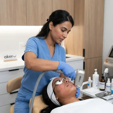 Clinician performing facial laser hair removal