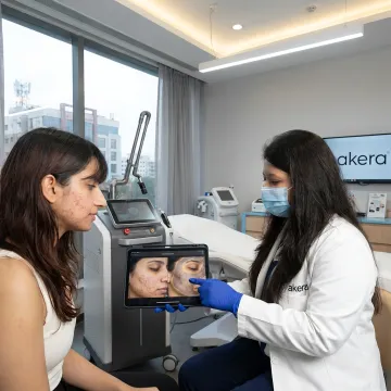 Dermatologist explaining laser facial plan