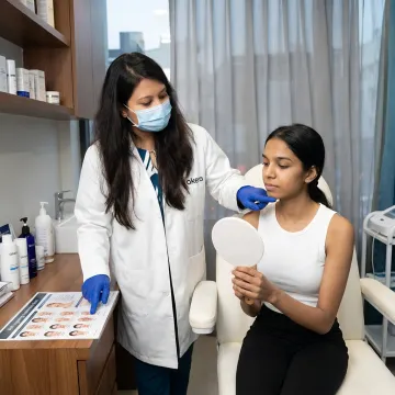 Dermatologist explaining anti-ageing treatment options