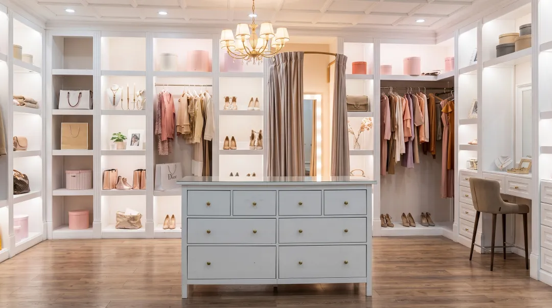 Luxury home organized walk-in closet with custom storage systems and elegant design