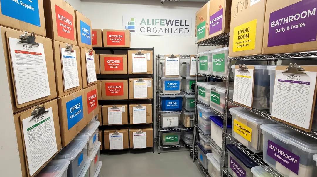 Color-coded moving box labeling system with room-specific tags and detailed inventory sheets