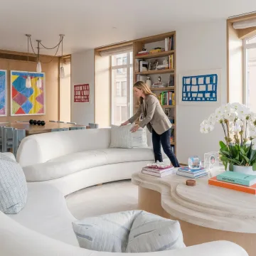 Organizer arranging a styled living room for home staging