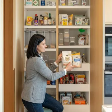 Professional organizer arranging family home storage