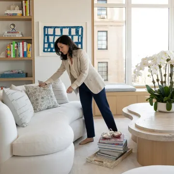 Designer arranging a staged living room