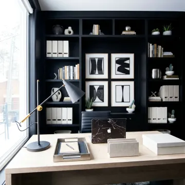 Styled commercial office with organized shelves and desks