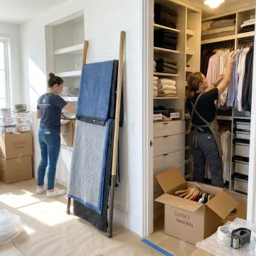 Professional organizers unpacking boxes in a new home