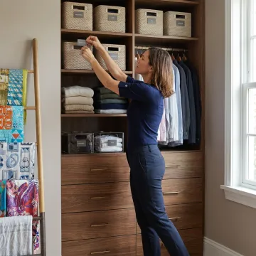 Professional organizer arranging a calm luxury home interior
