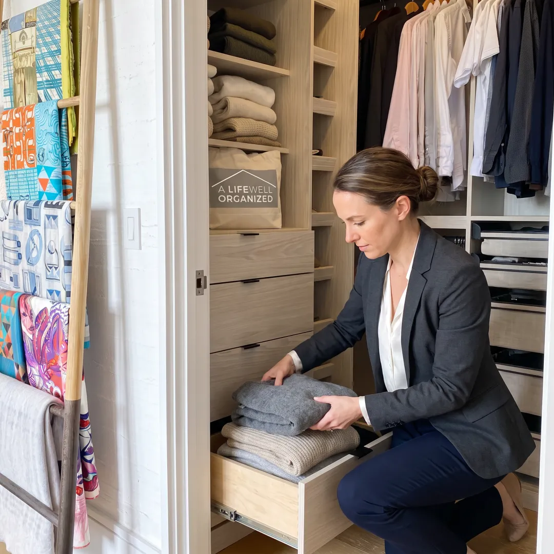 Organizer arranging a custom closet