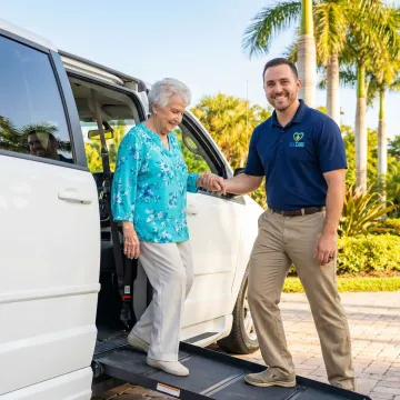 Compassionate driver assisting elderly woman into medical transport vehicle