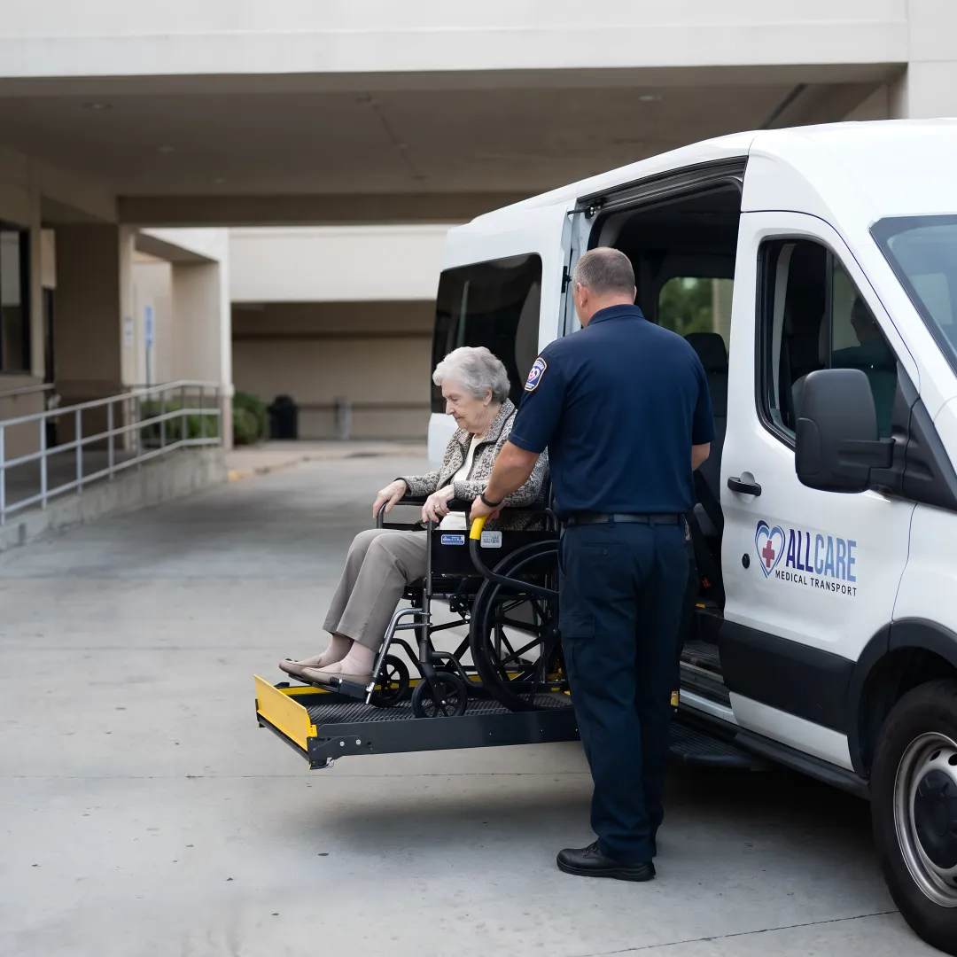 Professional medical transport vehicle assisting senior passenger