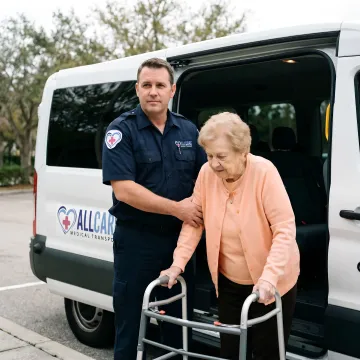 Senior patient receiving gentle assistance from NEMT driver