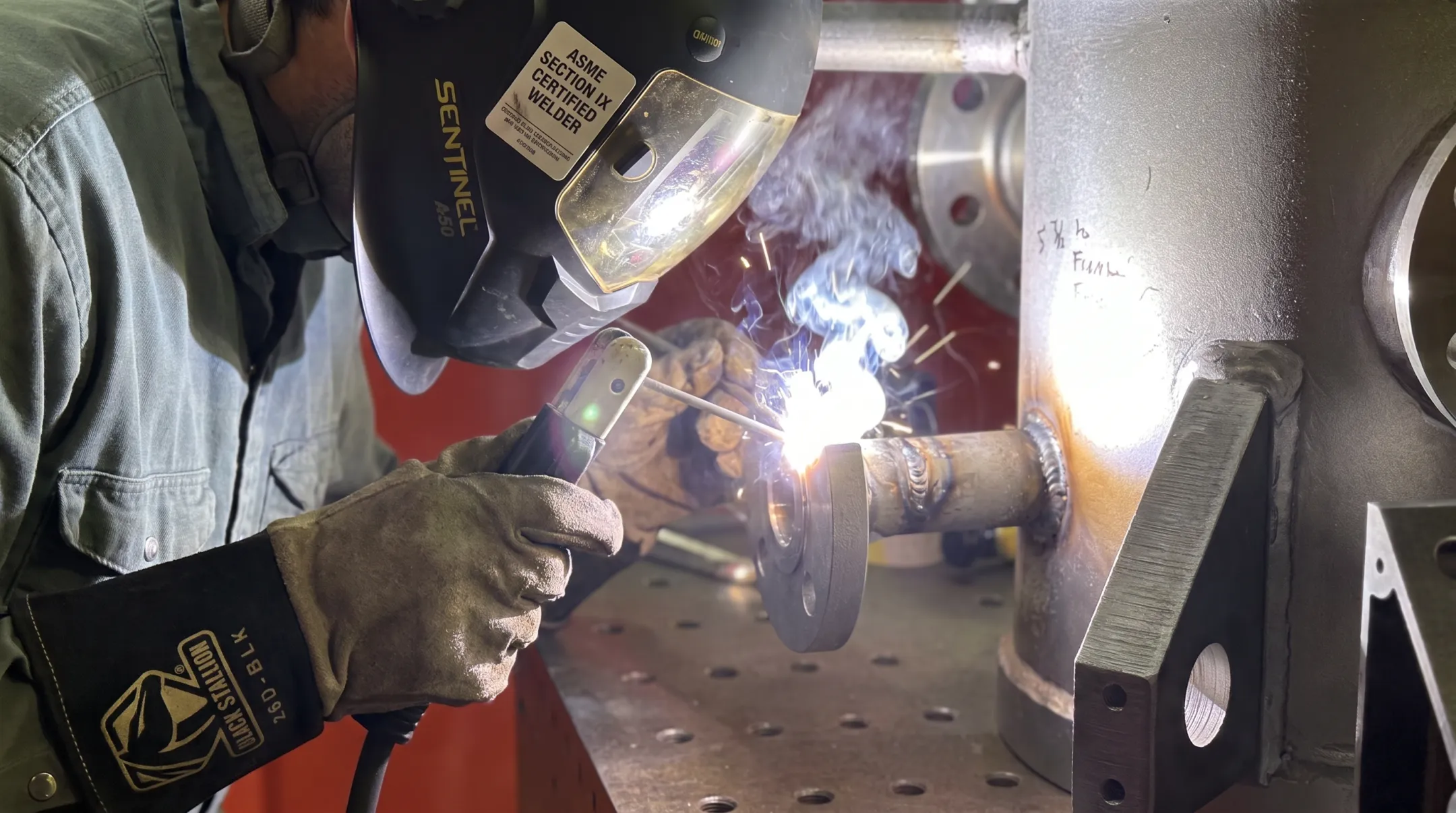 Certified welder performing code-compliant SMAW on pressure system component