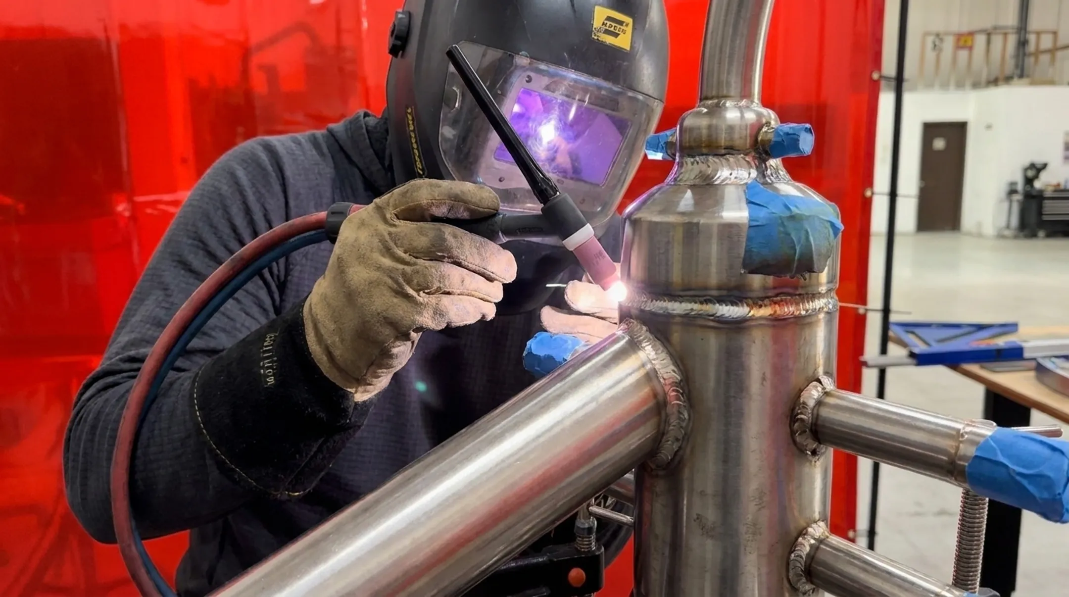 TIG welder joining Inconel and titanium alloy components in fabrication shop