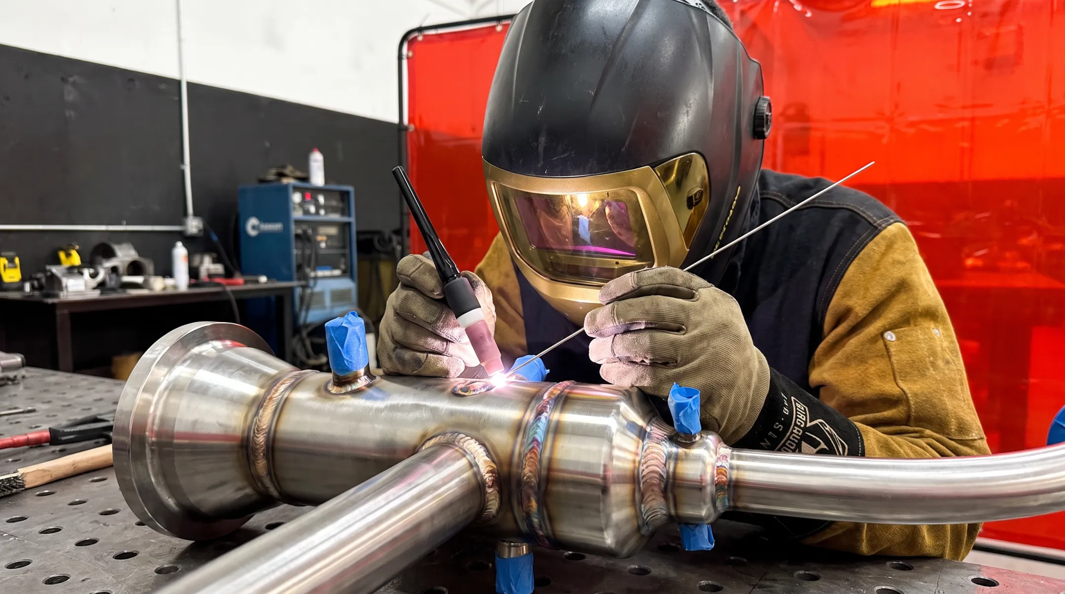Certified welder performing precision manual TIG welding on exotic alloy