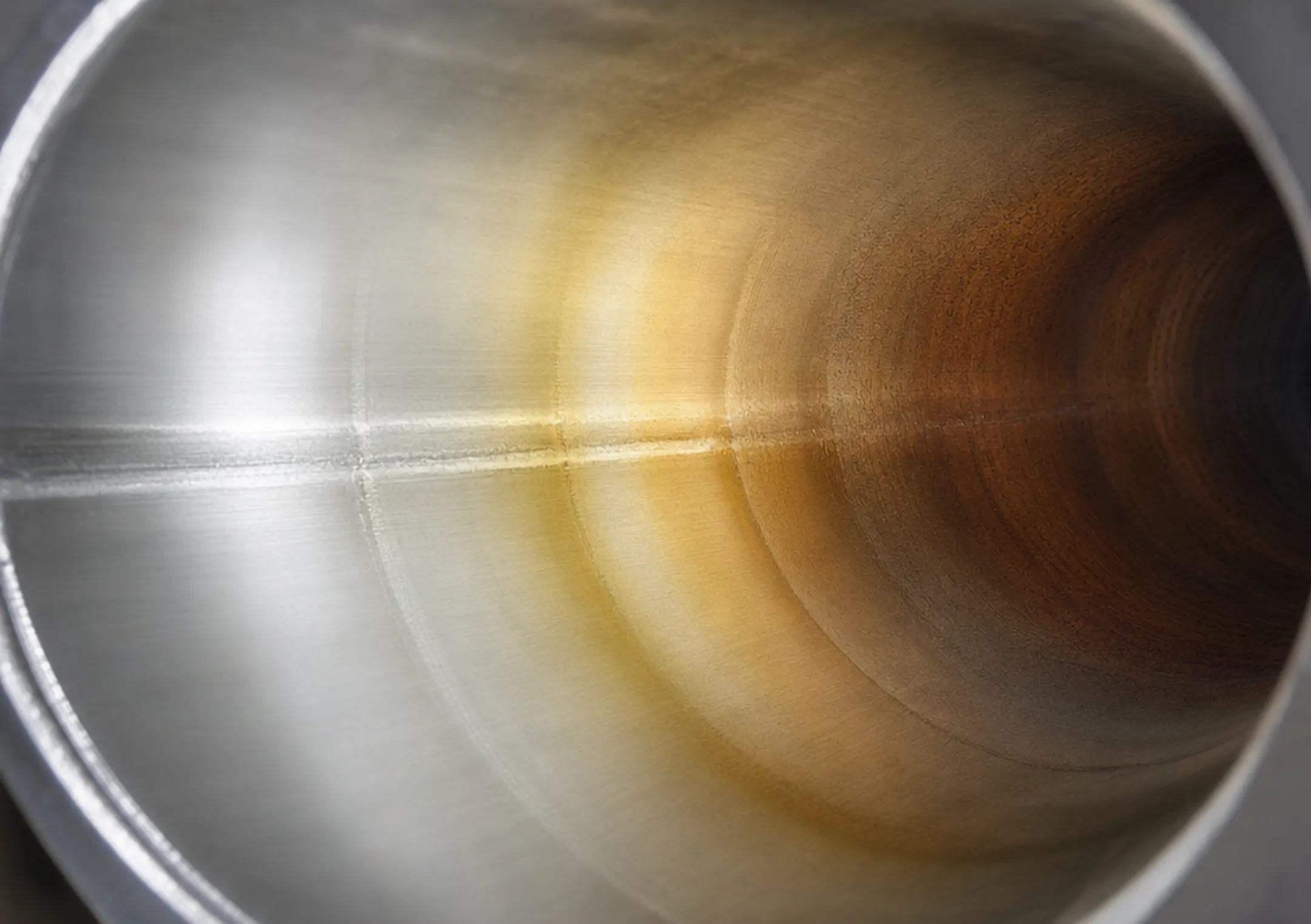 Heat tint discoloration scale chart on stainless steel weld interior surface