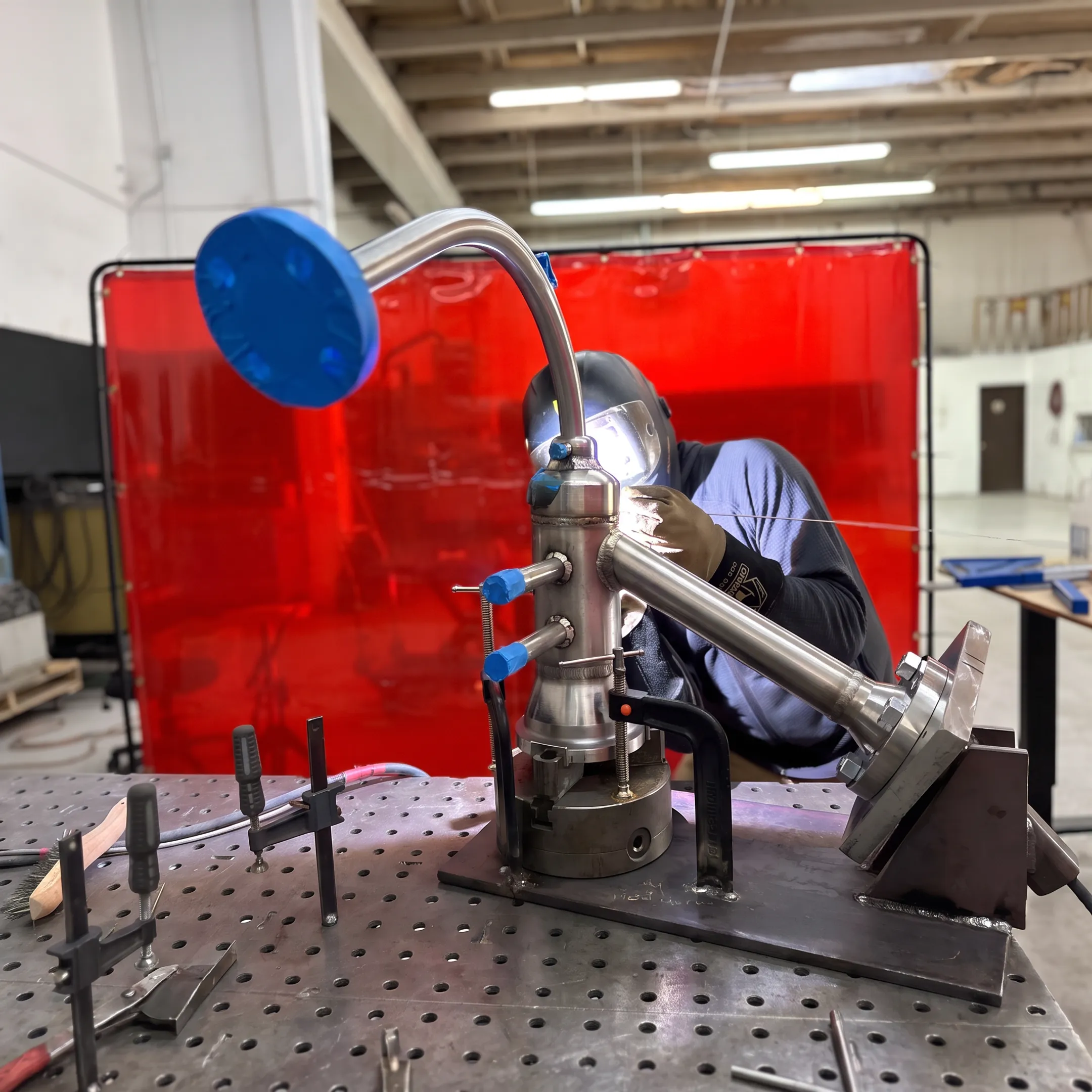 Welder performing precision inlay welding on a specialty metal component
