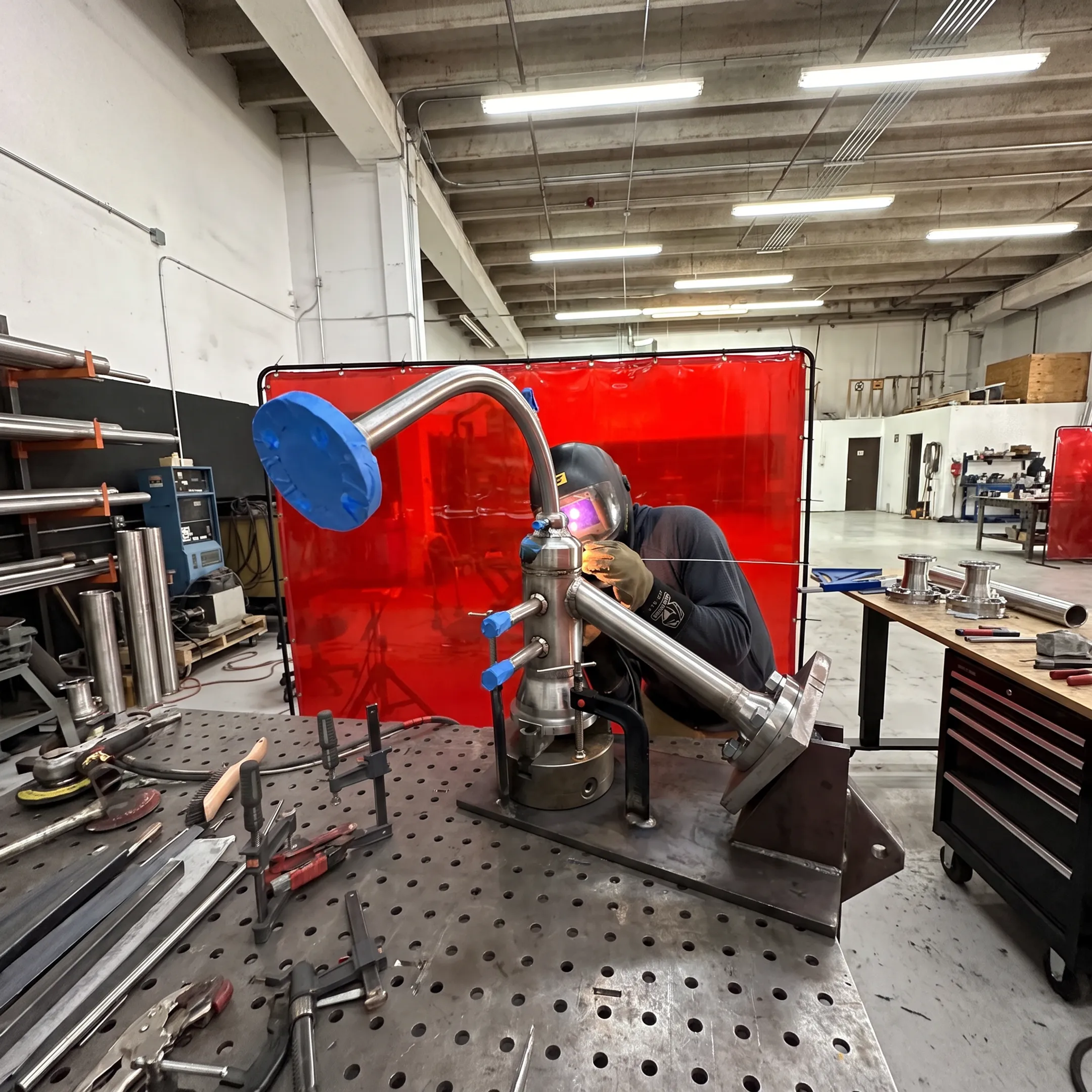 Specialty metal fabrication and precision welding in a professional workshop