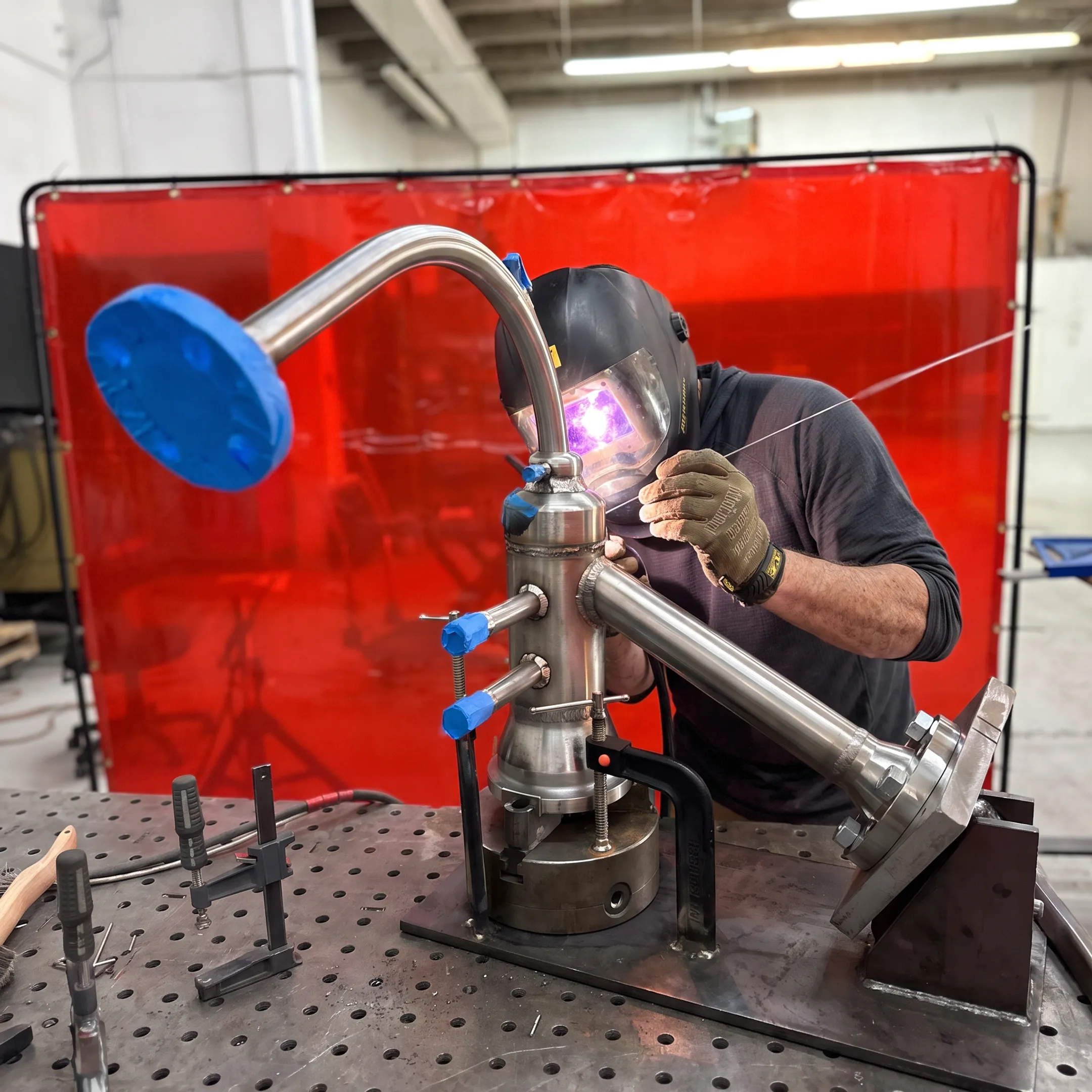 Welder fabricating a complex specialty alloy assembly