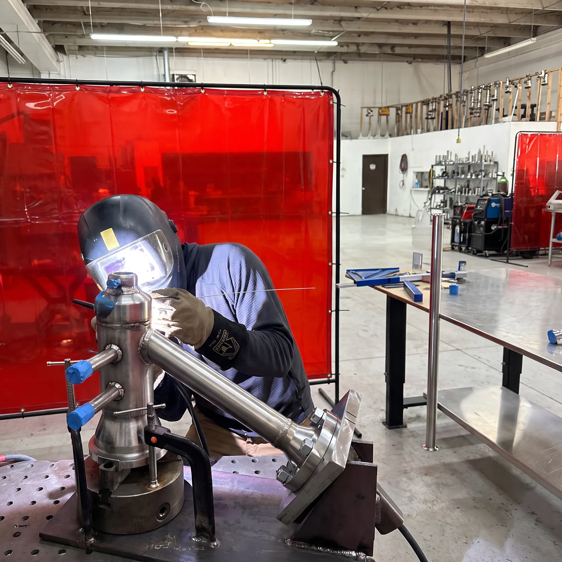 Mobile welder joining sanitary stainless steel piping in an industrial facility