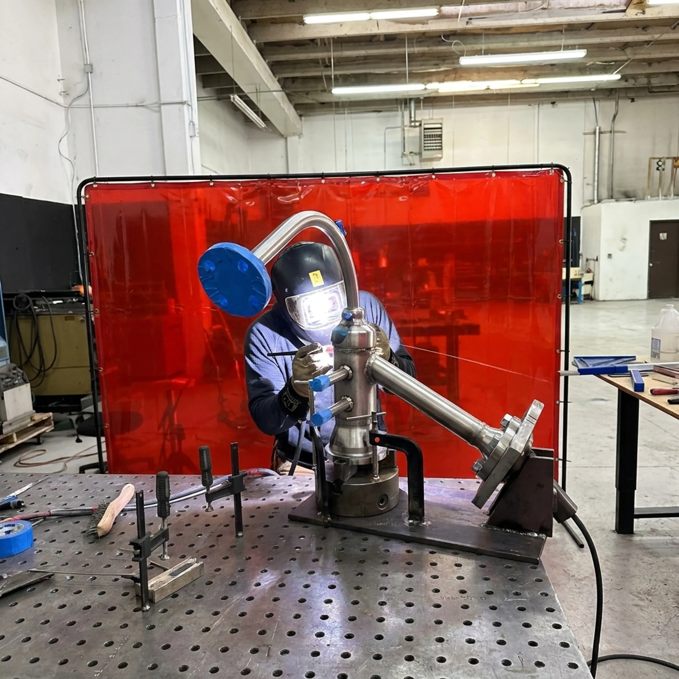 Technician welding an advanced energy component