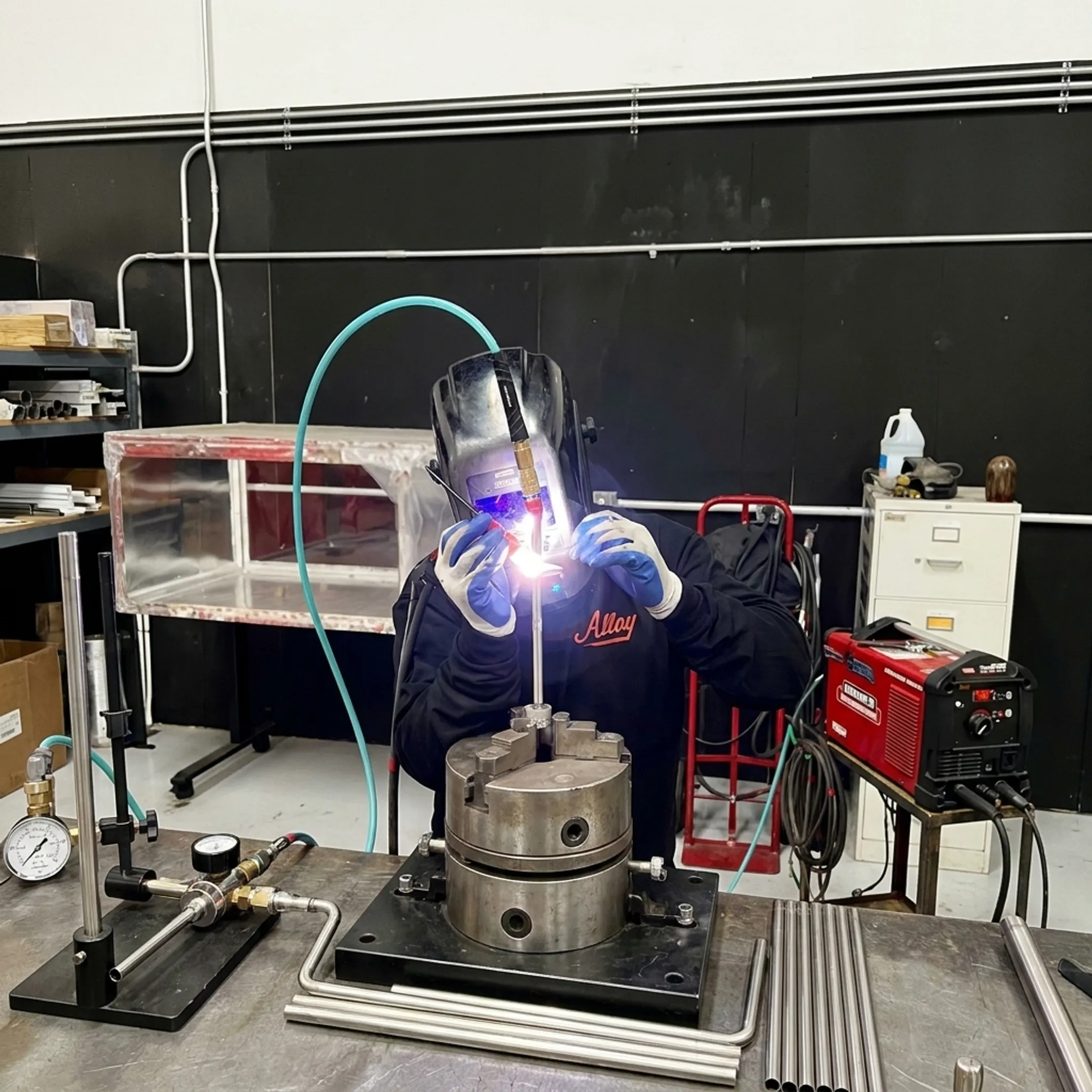 Welder fabricating an aerospace assembly