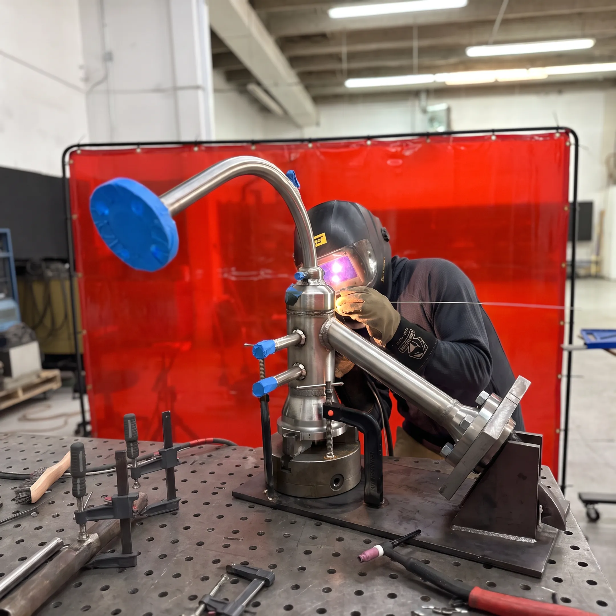 Aerospace technician precision welding a specialty-alloy component