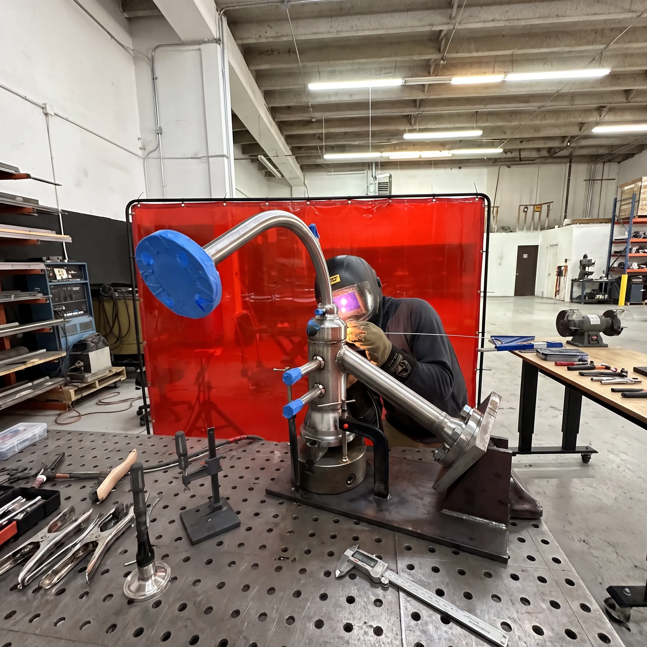 Stainless steel pressure vessel being precision welded in a fabrication shop