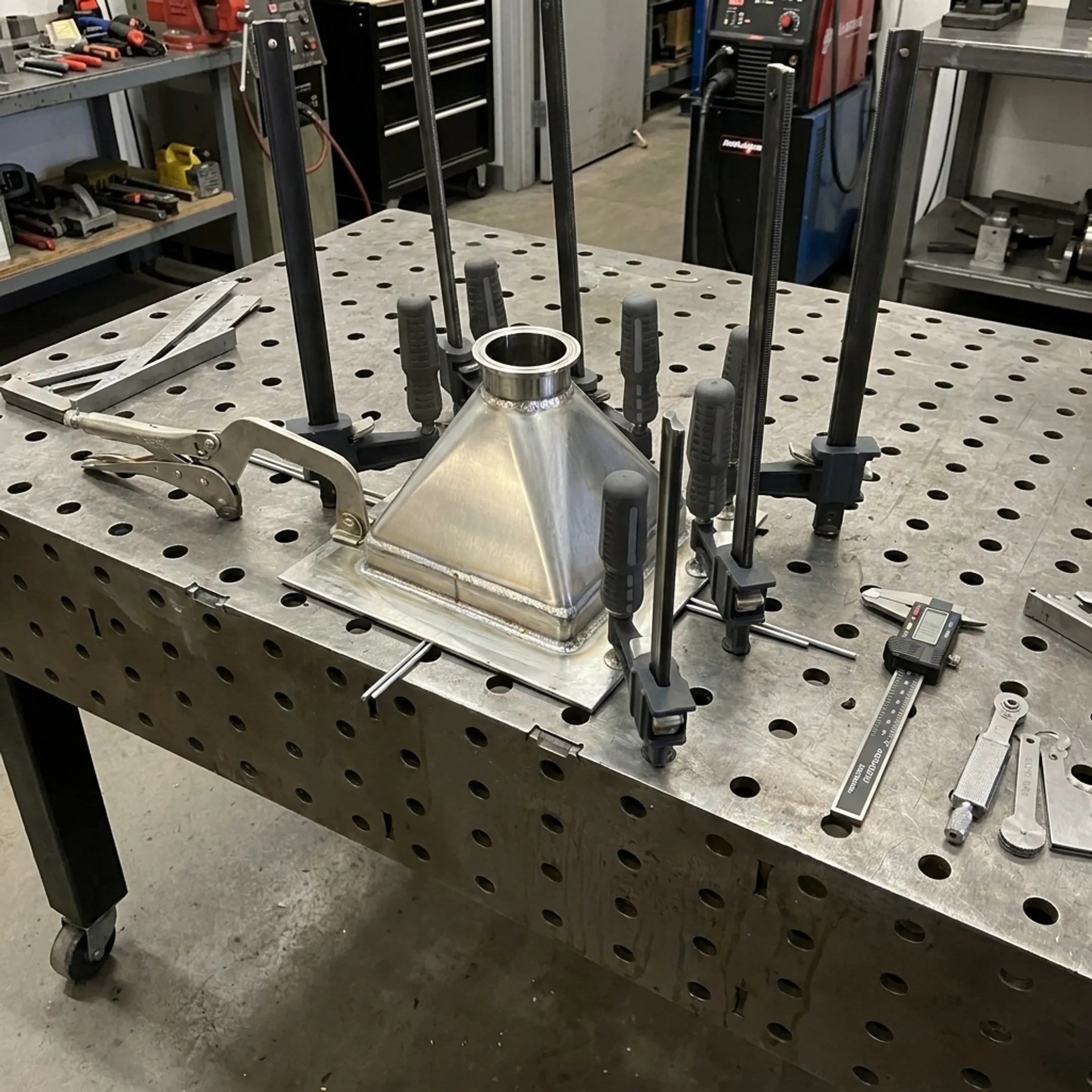 Custom aluminum welded component prepared for inspection