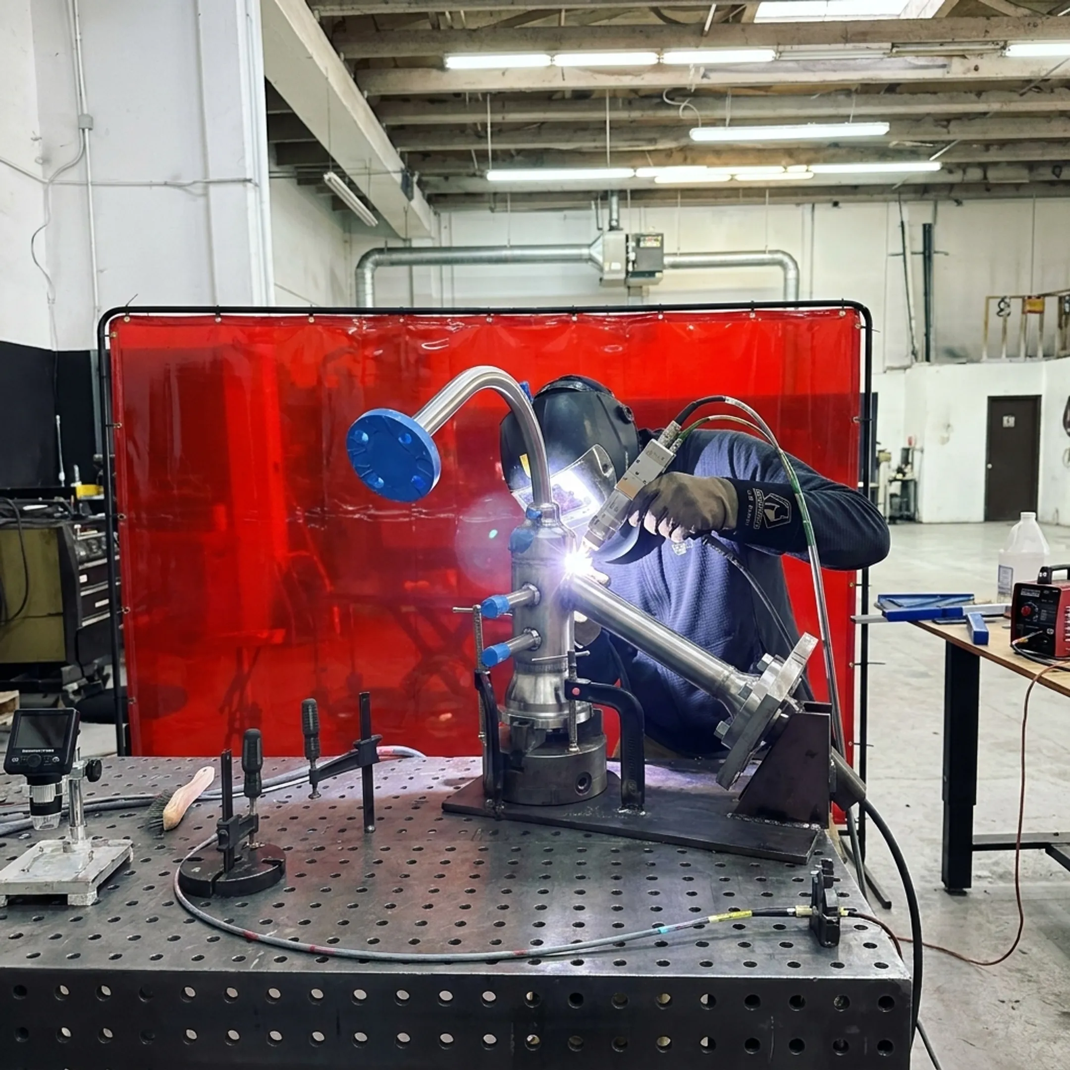 Technician performing controlled laser welding